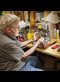 a man fixing a coffee maker