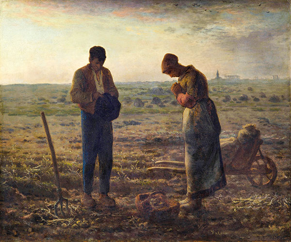 a man and a woman praying in a field