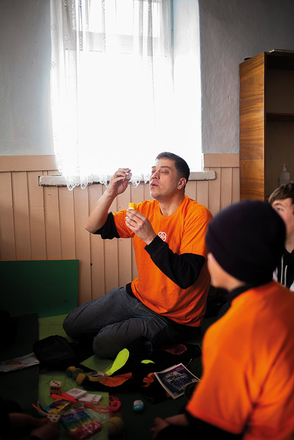 a man blowing bubbles