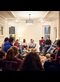 people sitting in a circle in a room