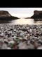 colorful pebbles by water