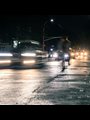 car lights on a dark wet road