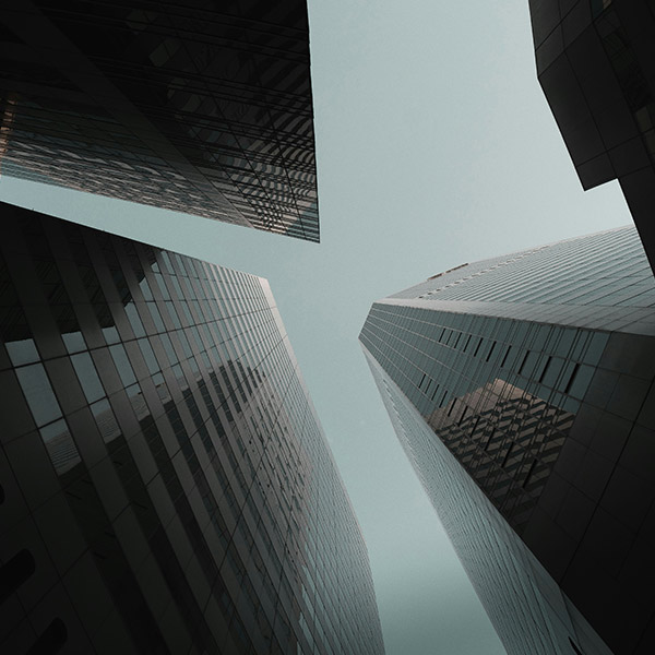 looking up at skyscrapers