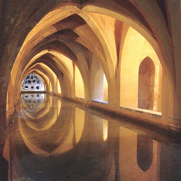 painting of an arched hallway