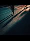 people's shadows on a road
