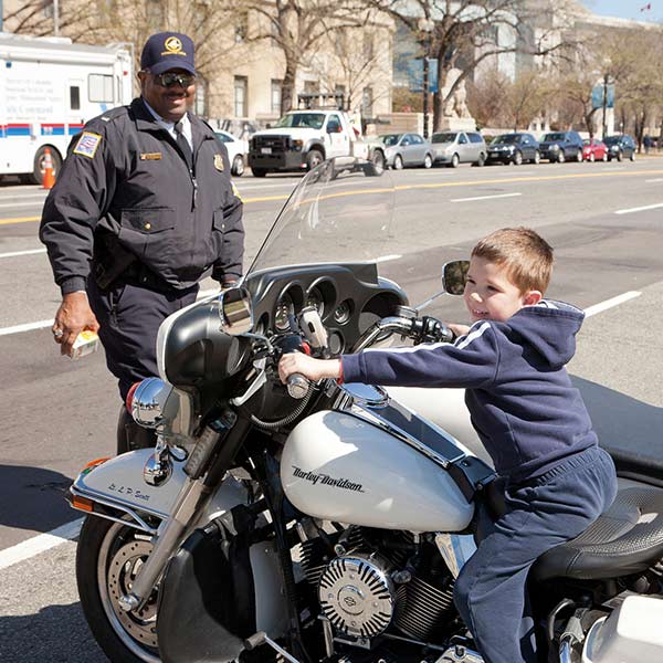 child sitting on a motorbike 