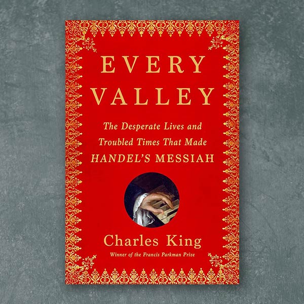 red book cover with a small picture of a hand playing piano