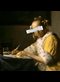 painting of a woman writing at a desk