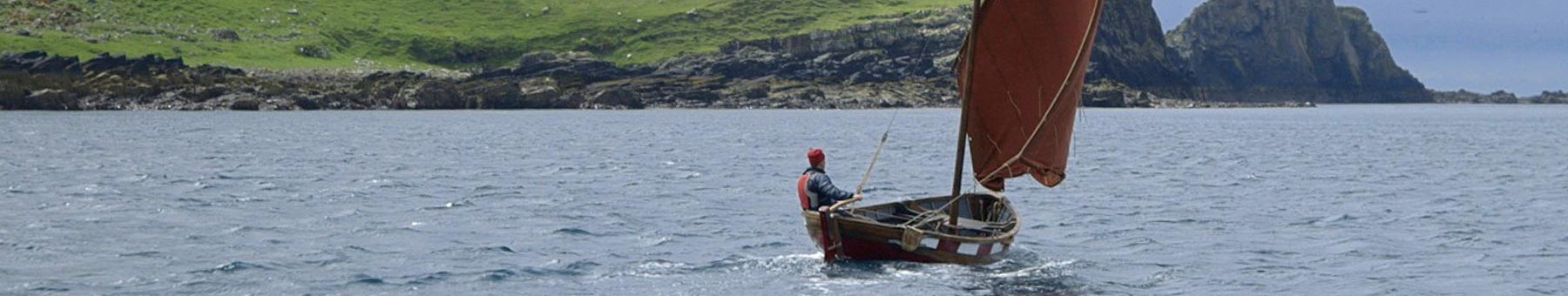 a man in a boat on the ocean