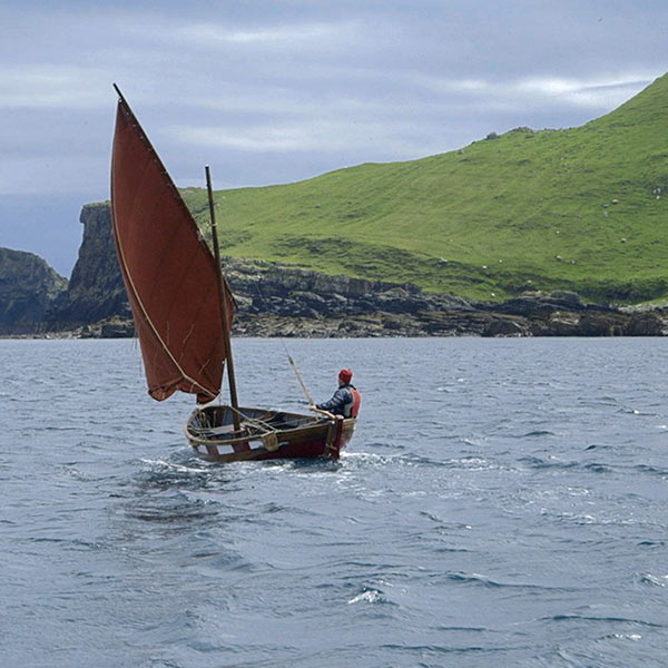 sailboat by an island