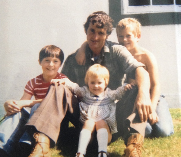 man with three children