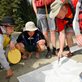 Boy Scouts and leader looking at a map on the ground