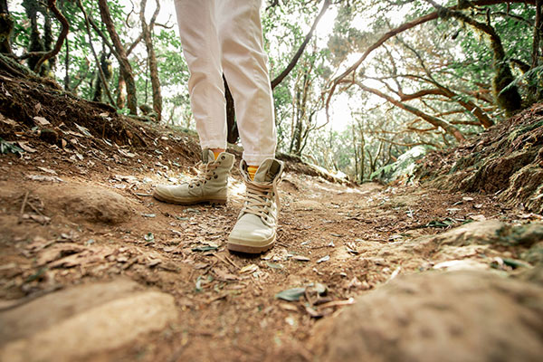 a woman hiking on a trail