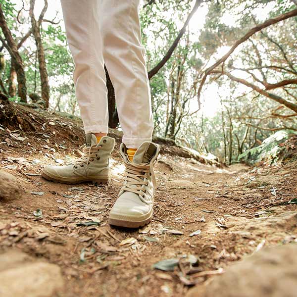 a woman hiking on a trail