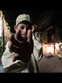 a boy reaching his hand out
