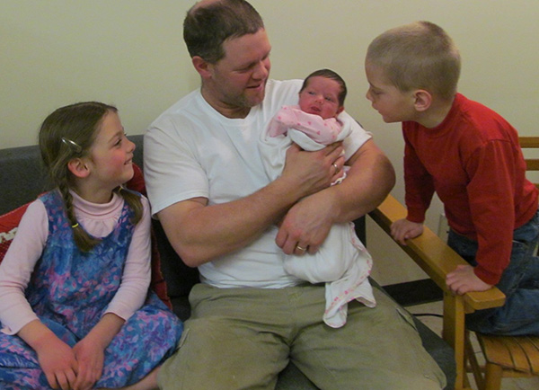 a father with his three children