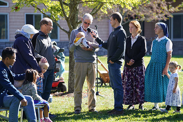 a baby receiving a church blessing