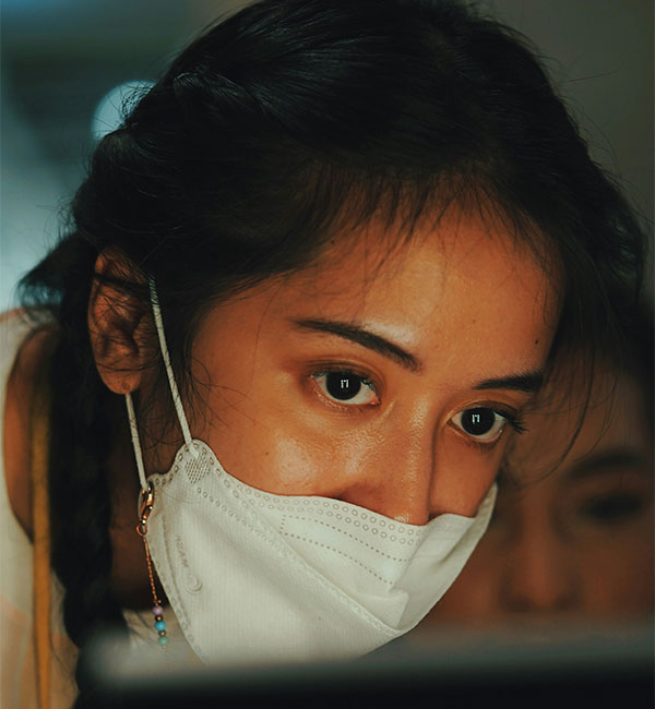 a woman with a white mask