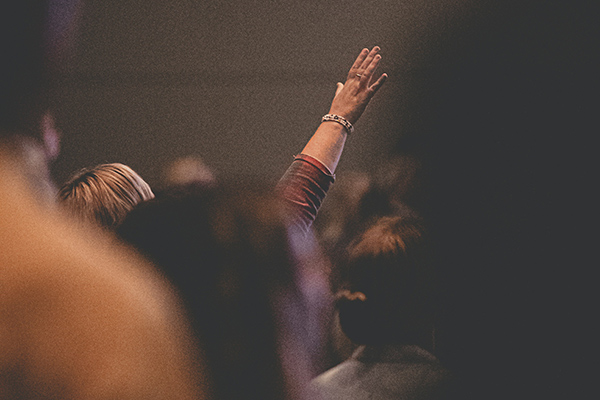 woman praising in a church service