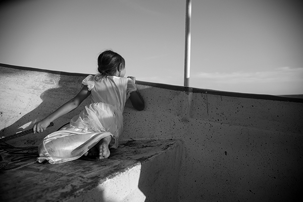 a girl looking over the side of a boat