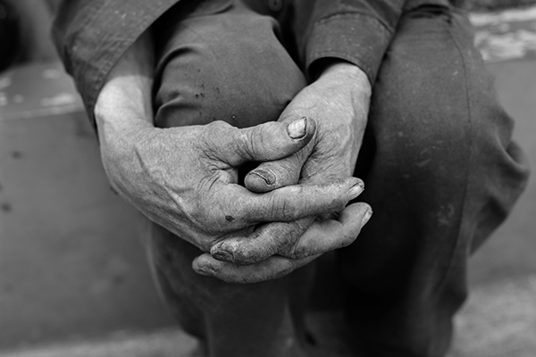 an old man's folded hands