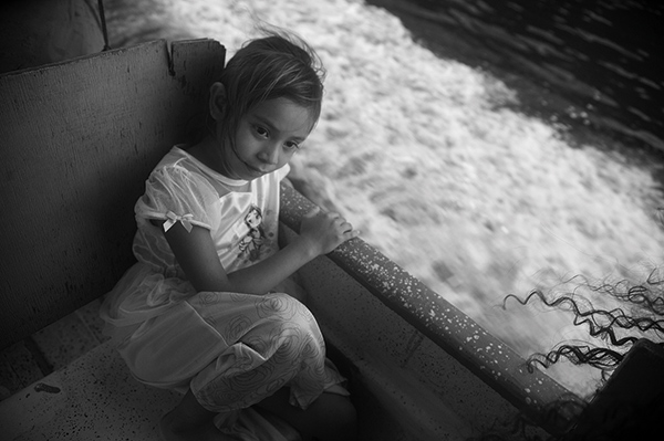 a girl sitting in a boat