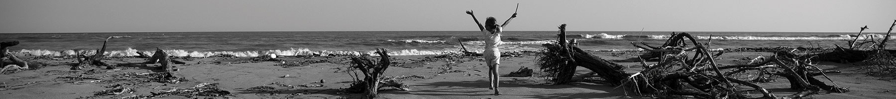 a girl running on a beach