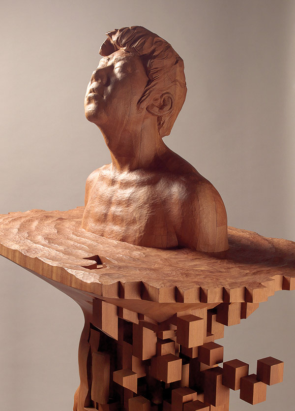 wood sculpture of a man