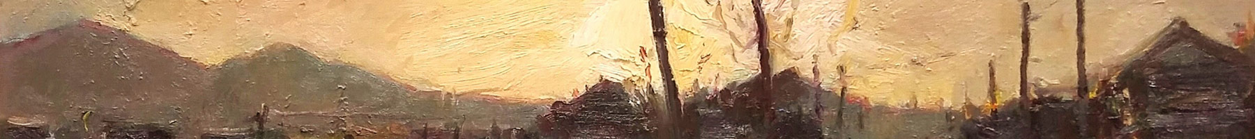 sun setting over a country village