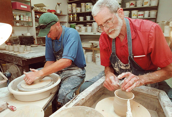 two men making pottery