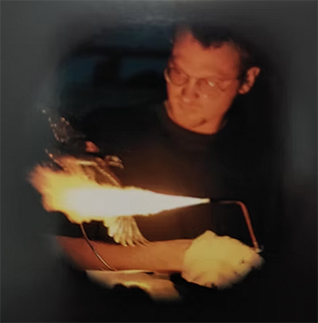 a sculpture artist welding