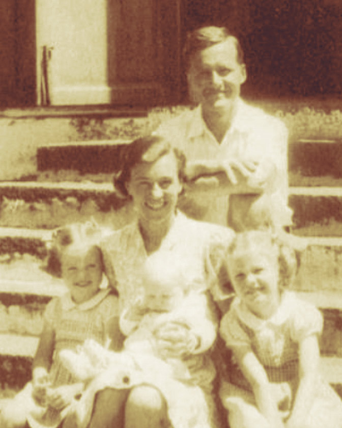 a photo of smiling parents and children