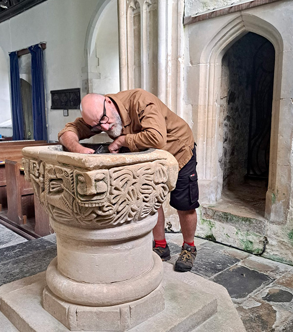 Author surveys an Anglo-Saxon font in St Mary's, Luppitt, Devon