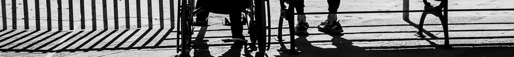 two old people sitting by the ocean