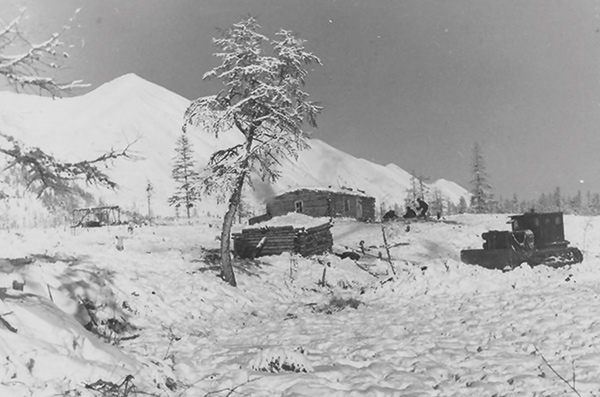 a house in a snow covered landscape