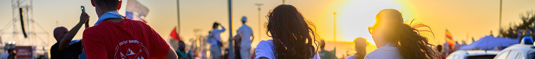 teenagers running down a road
