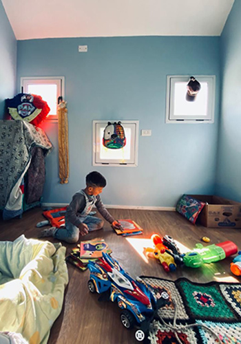 a boy playing in his room